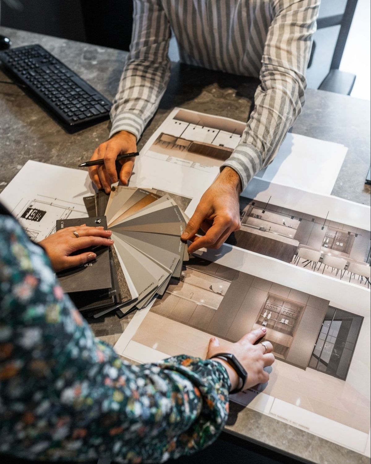Elidalin Interiors studio team collaborating over drawings